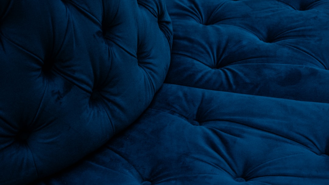a close up of a blue couch cushion
