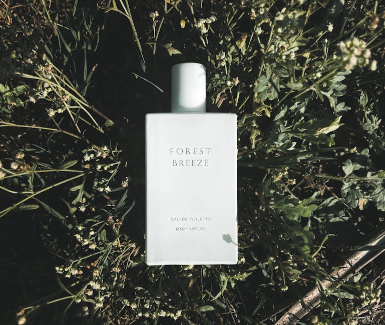 Aesthetic photo of Forest Breeze perfume bottle surrounded by greenery.