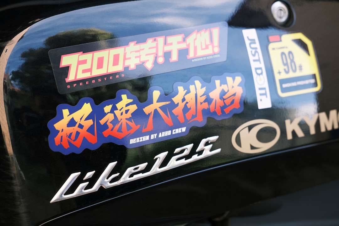 a close up of a motorcycle with a lot of stickers on it