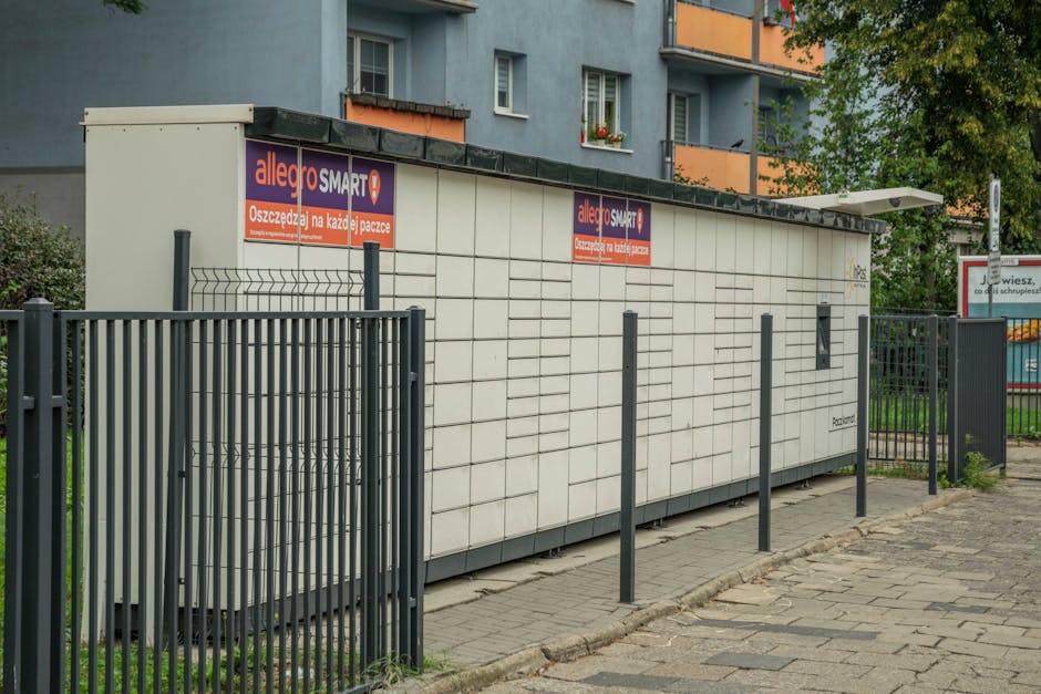 Outdoor parcel locker in Wroclaw, with Allegro Smart advertisement, near residential buildings.